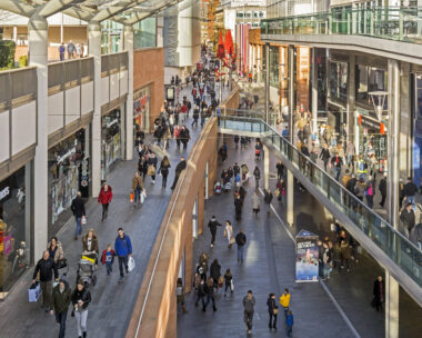 View of a busy shopping street in the centre of Liverpool, UK Shops can be seen on either side of the photograph and people can be seen walking on the pavements