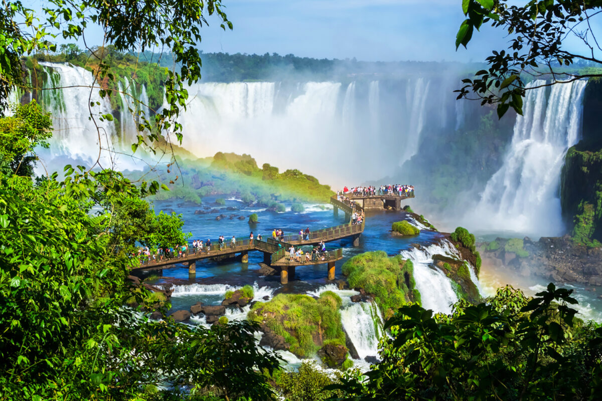 Tourists at Iguazu Falls, one of the world's great natural wonders, near the border of Argentina and Brazil.