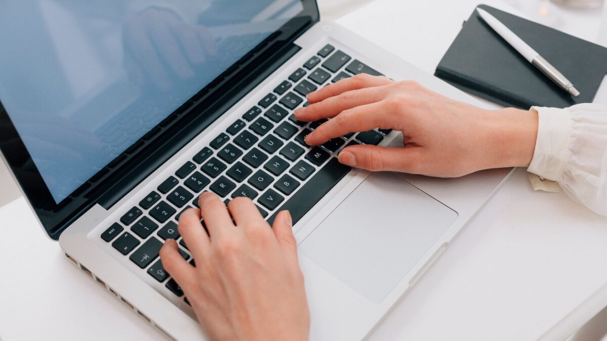 Close Up Of Woman Using Laptop