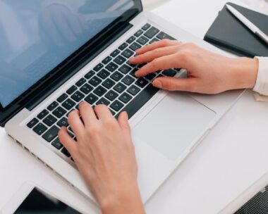 Close Up Of Woman Using Laptop