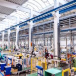Color image of futuristic new factory producing plastic pieces for car industry
