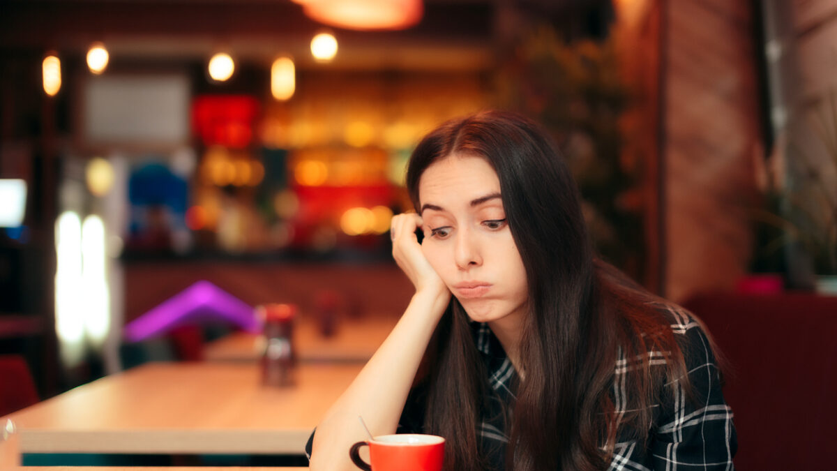Stood up woman having a bad time alone in the restaurant