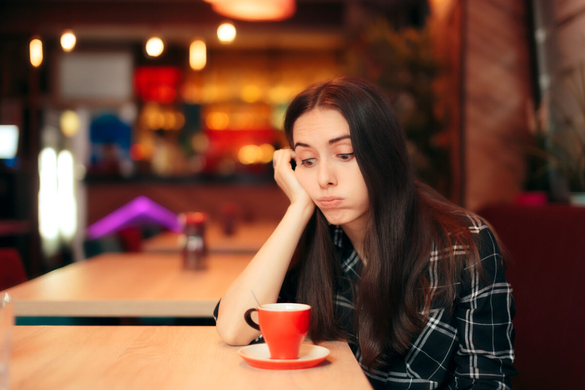 Stood up woman having a bad time alone in the restaurant
