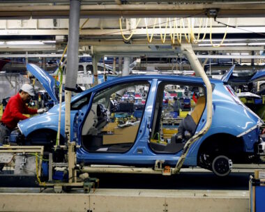 An employee of Nissan Motor works on its Leaf electric car on an assembly line at Oppama plant, in Yokosuka, south of Tokyo January 25, 2011.