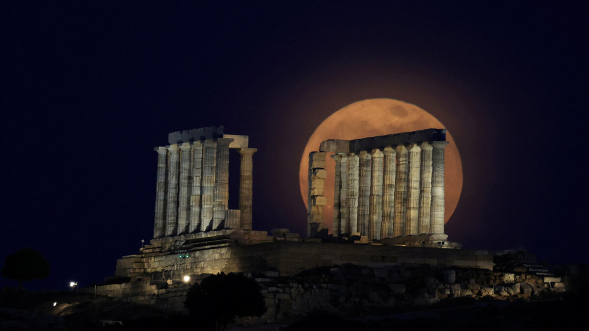 The full moon, known as a "Flower Moon" rises behind the Temple of Poseidon in Cape Sounion, near Athens, Greece, May 12, 2025. REUTERS/Louisa Gouliamaki