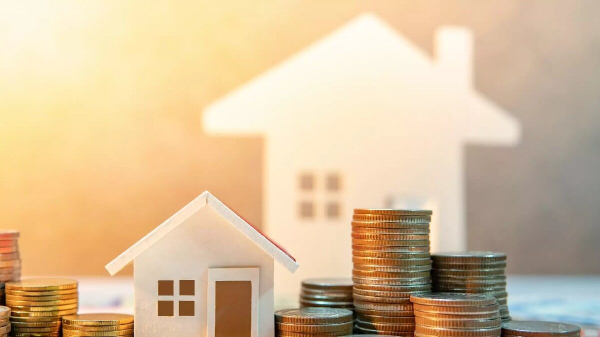Real estate or property investment. Home mortgage loan rate. Saving money for retirement concept. Coin stack on international banknotes with house model on table. Business growth background