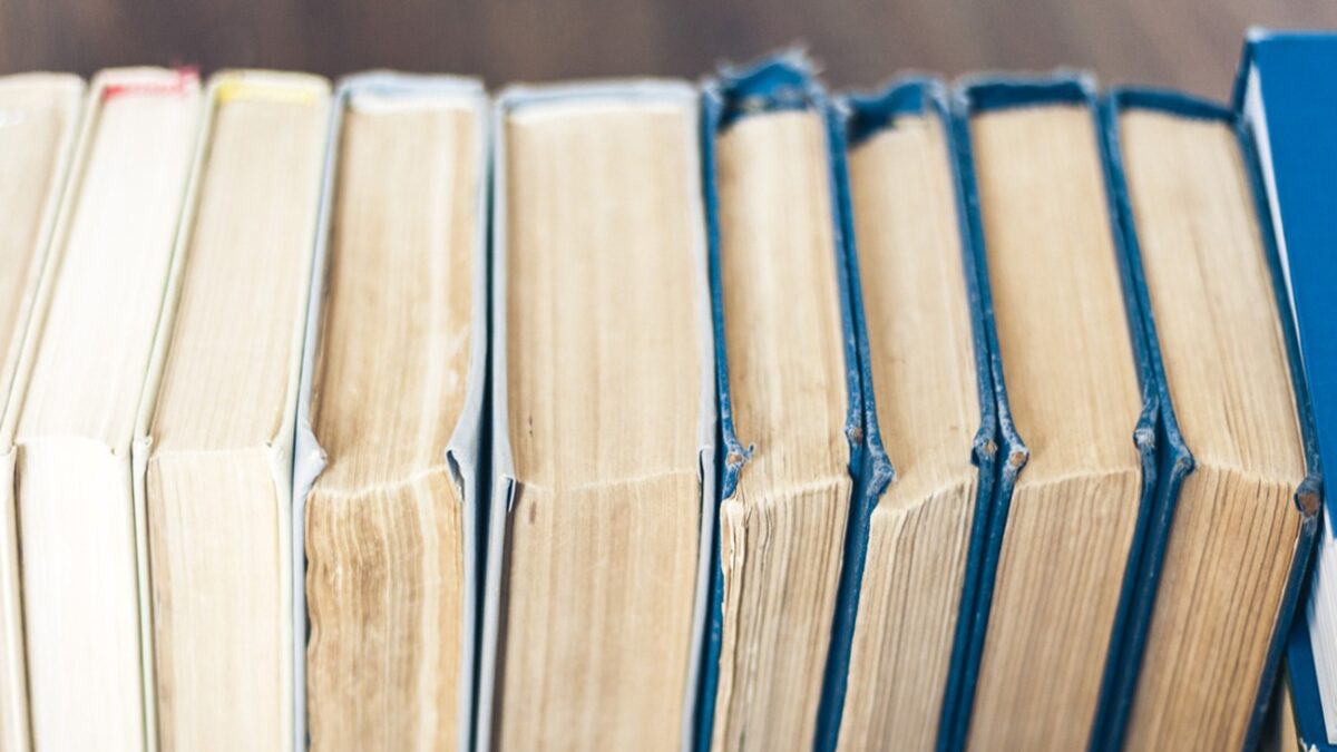 Stack of old book education concept background, many books piles with copy space for text