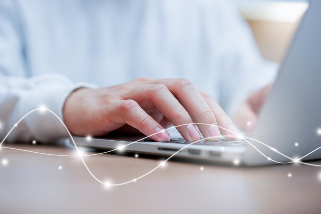 close up network man typing on keyboard laptop to access internet with virtual interface fiber optical   telecommunication to exchange data information in the cyber network for business and futuristic technology communication concept