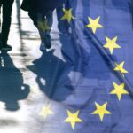 EU or European Union Flag and shadows of people, concept political picture