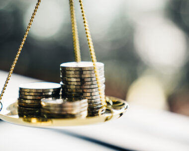 Coins stack with balance scale. Money management, financial plan, time value of money, business idea and Creative ideas for saving money concept.
