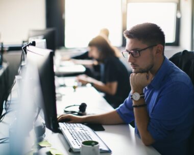 Computer programmer working on new software program