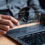 Businessman Inspecting Paperwork Document of Business Data Analysis working Management report with KPI and metrics connected to database. Corporate strategy for finance, operations, sales, marketing.