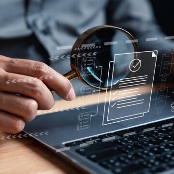 Businessman Inspecting Paperwork Document of Business Data Analysis working Management report with KPI and metrics connected to database. Corporate strategy for finance, operations, sales, marketing.