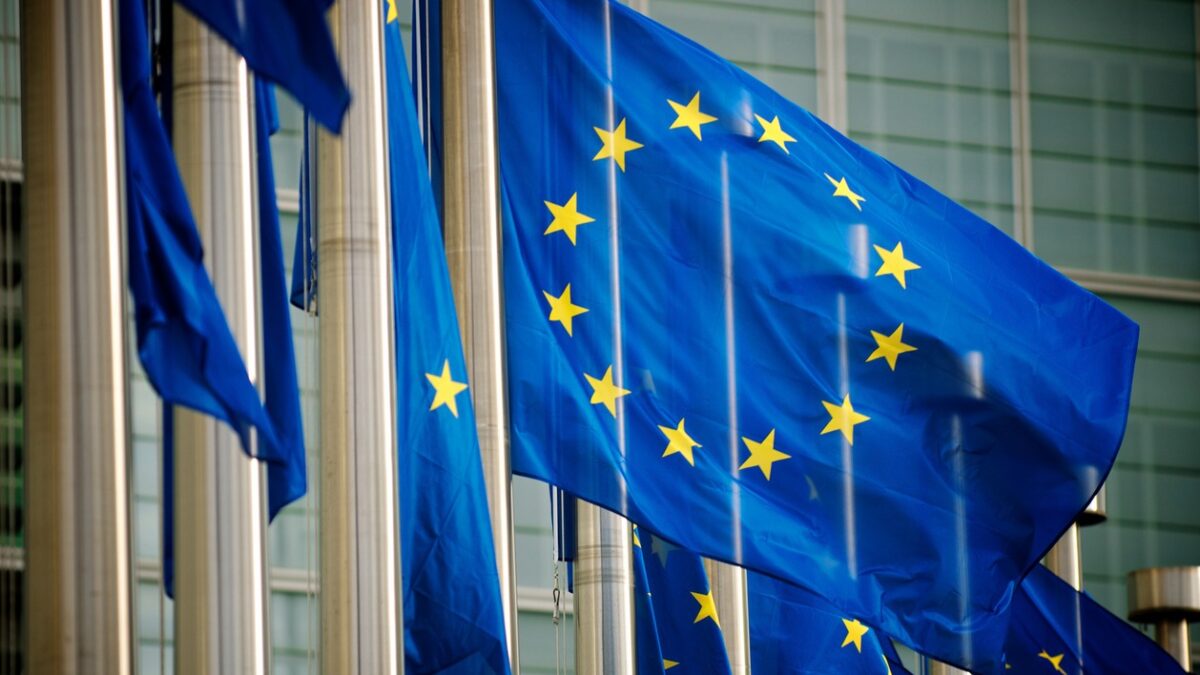 EU flags fly in a row in front of the European Commission building in Brussels, Belgium