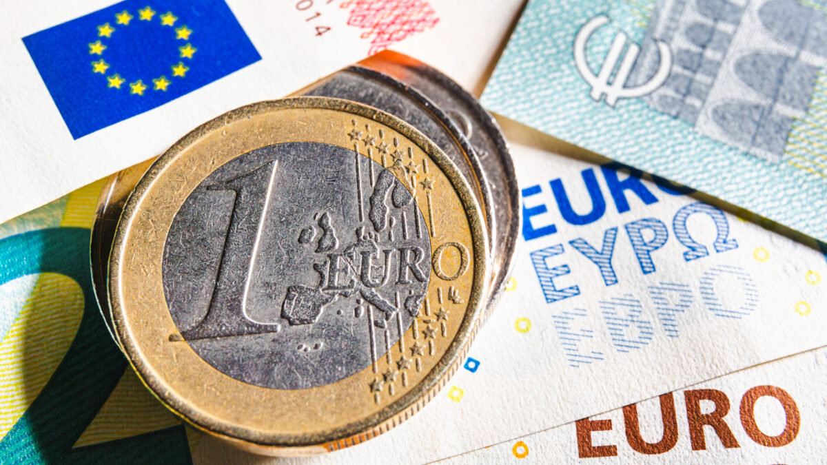 European money. Euro currency. Coins and banknotes. One Euro coin