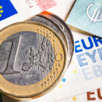 European money. Euro currency. Coins and banknotes. One Euro coin