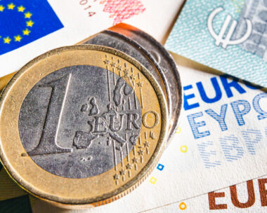 European money. Euro currency. Coins and banknotes. One Euro coin