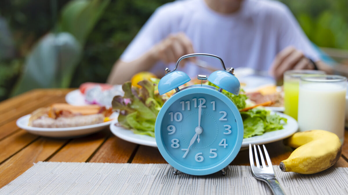Alarm clock with IF (Intermittent Fasting) 16 and 8 diet rule and weight loss concept.-Diet plan concept