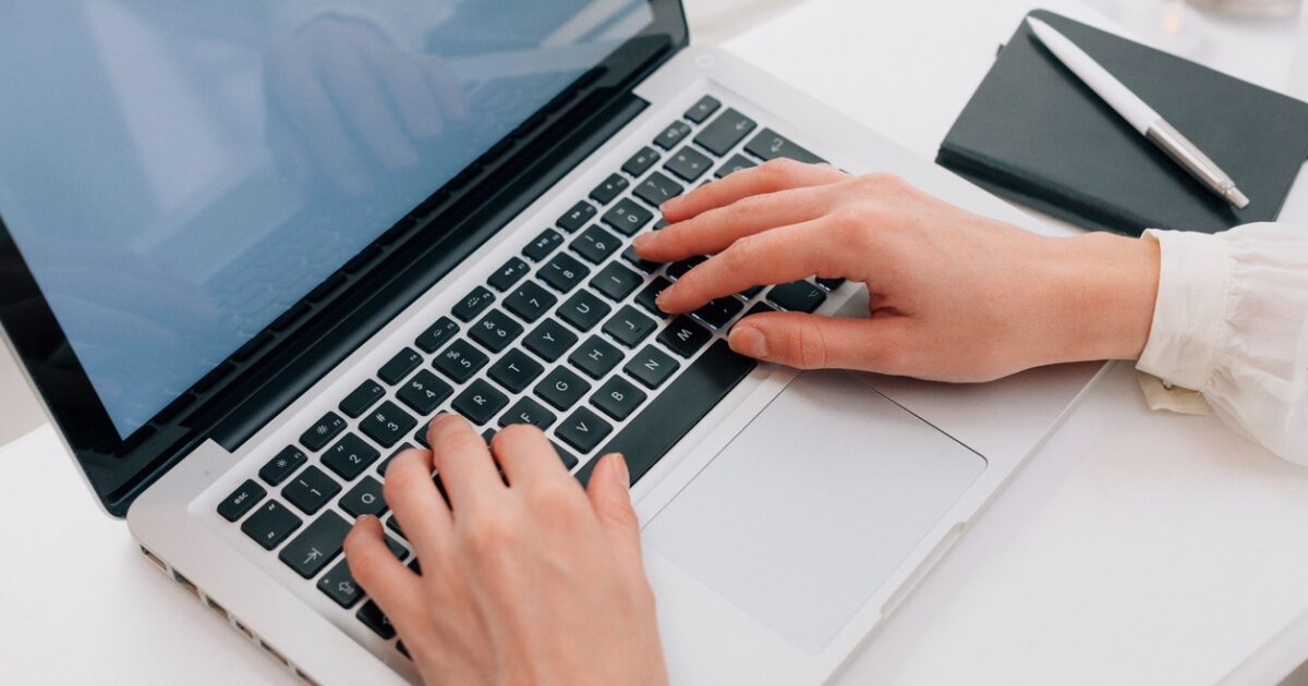 Close Up Of Woman Using Laptop