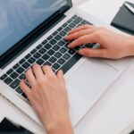 Close Up Of Woman Using Laptop