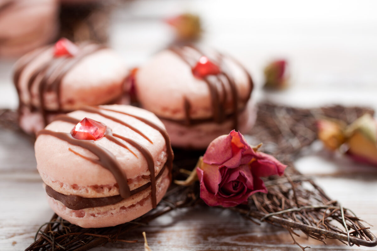 Pink macarons with chocolate and edible diamond