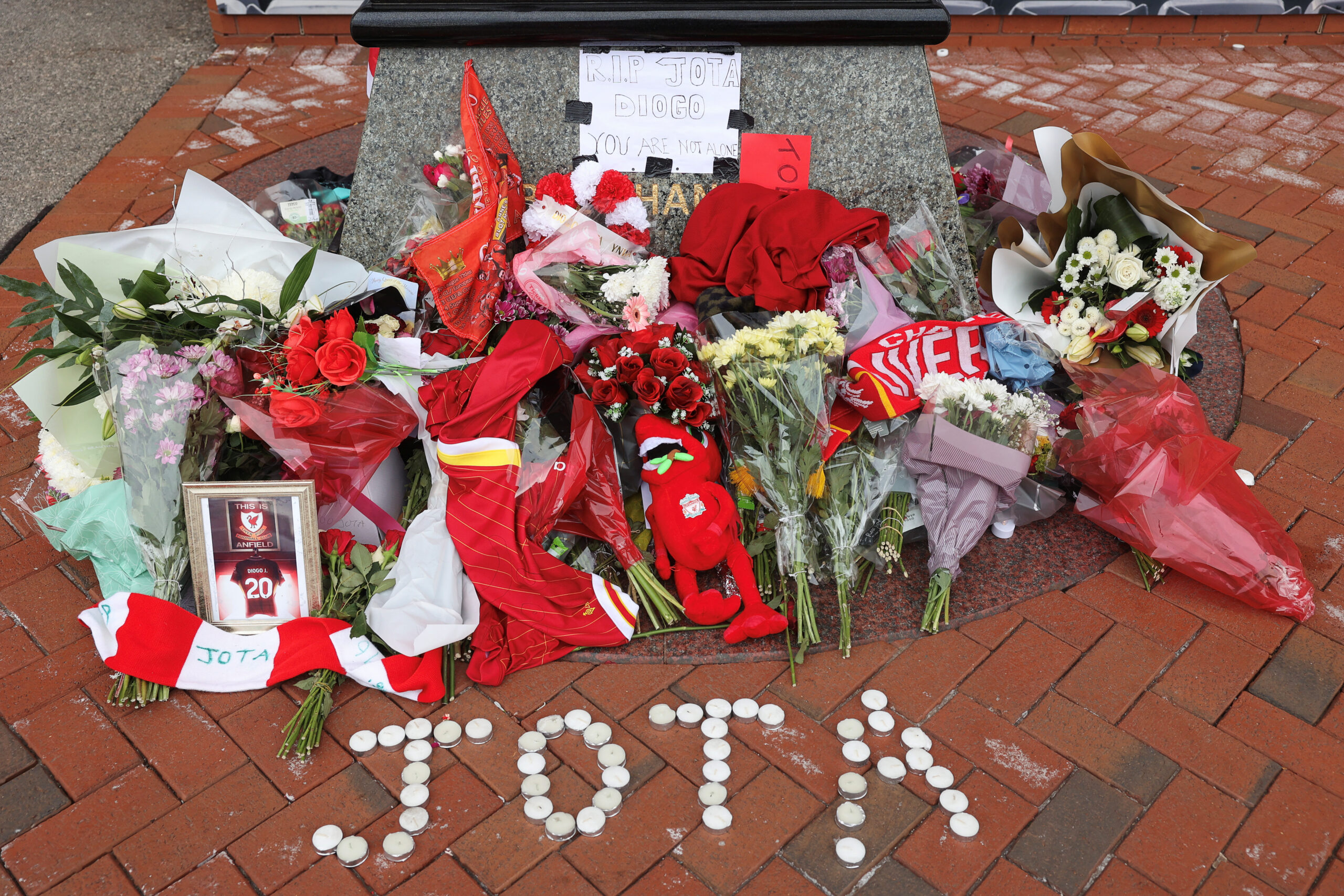 Tributes pay respect to Liverpool's Portuguese soccer player Diogo Jota, who died in a car crash near Zamora, Spain, outside Liverpool's Anfield Stadium in Liverpool, Britain, July 4, 2025. REUTERS