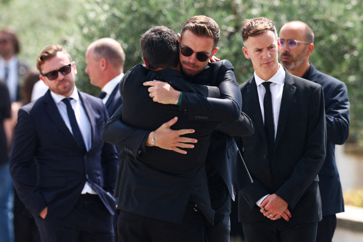 Former Liverpool Captain Jordan Henderson hugs a mourner, at the funeral ceremony of Liverpool's Portuguese soccer player Diogo Jota and his brother Andre Silva, who died in a car crash near Zamora, Spain, at the Chapel of the Resurrection, in Gondomar, Portugal, July 5, 2025. REUTERS
