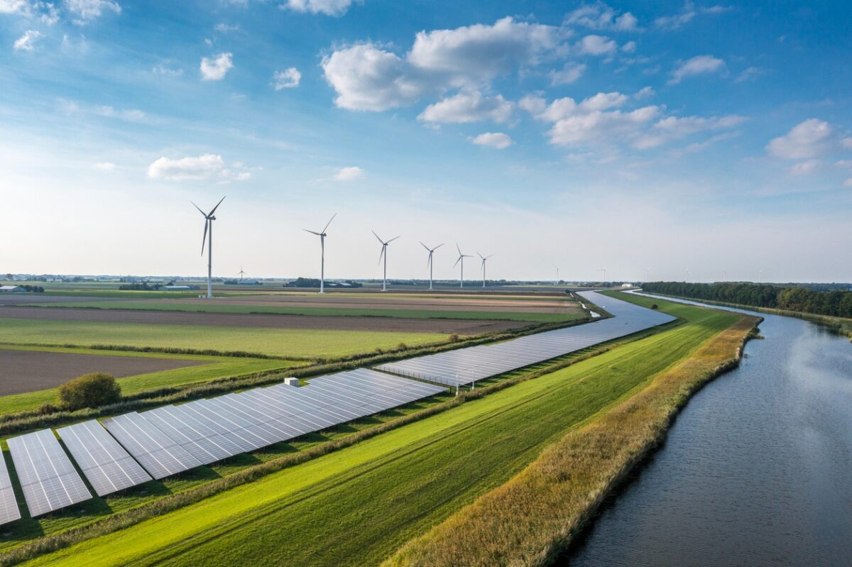 Solar panels and wind turbines generating renewable energy for green and sustainable future