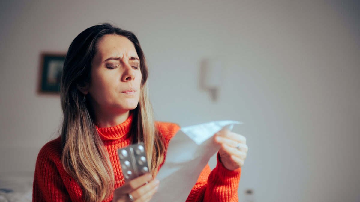 Person suffering from presbyopia squinting to read