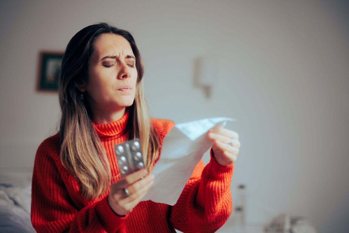Person suffering from presbyopia squinting to read