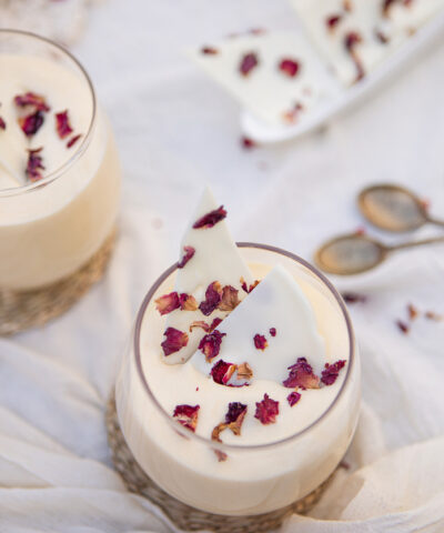 Delicious white chocolate mousse dessert with rose petals served in a glass cup - Argentine culture - Buenos Aires - Argentina