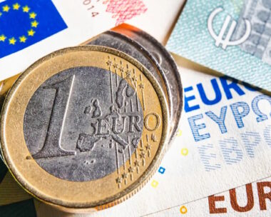 European money. Euro currency. Coins and banknotes. One Euro coin