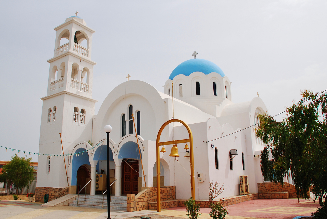Agistri, Greece - May 12, 2016: The domed church of Agioi Anargyroi at Skala on the Greek island of Agistri. The small island is under an hour from Piraeus harbour in Athens.