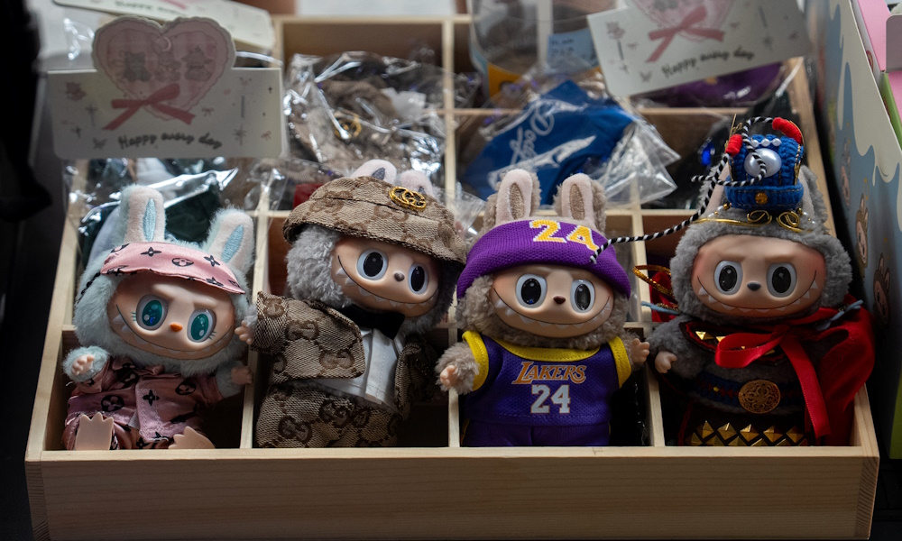 Counterfeit Labubu dolls are displayed for sale on the sidewalk in Manhattan, New York City, U.S., July 22, 2025. REUTERS