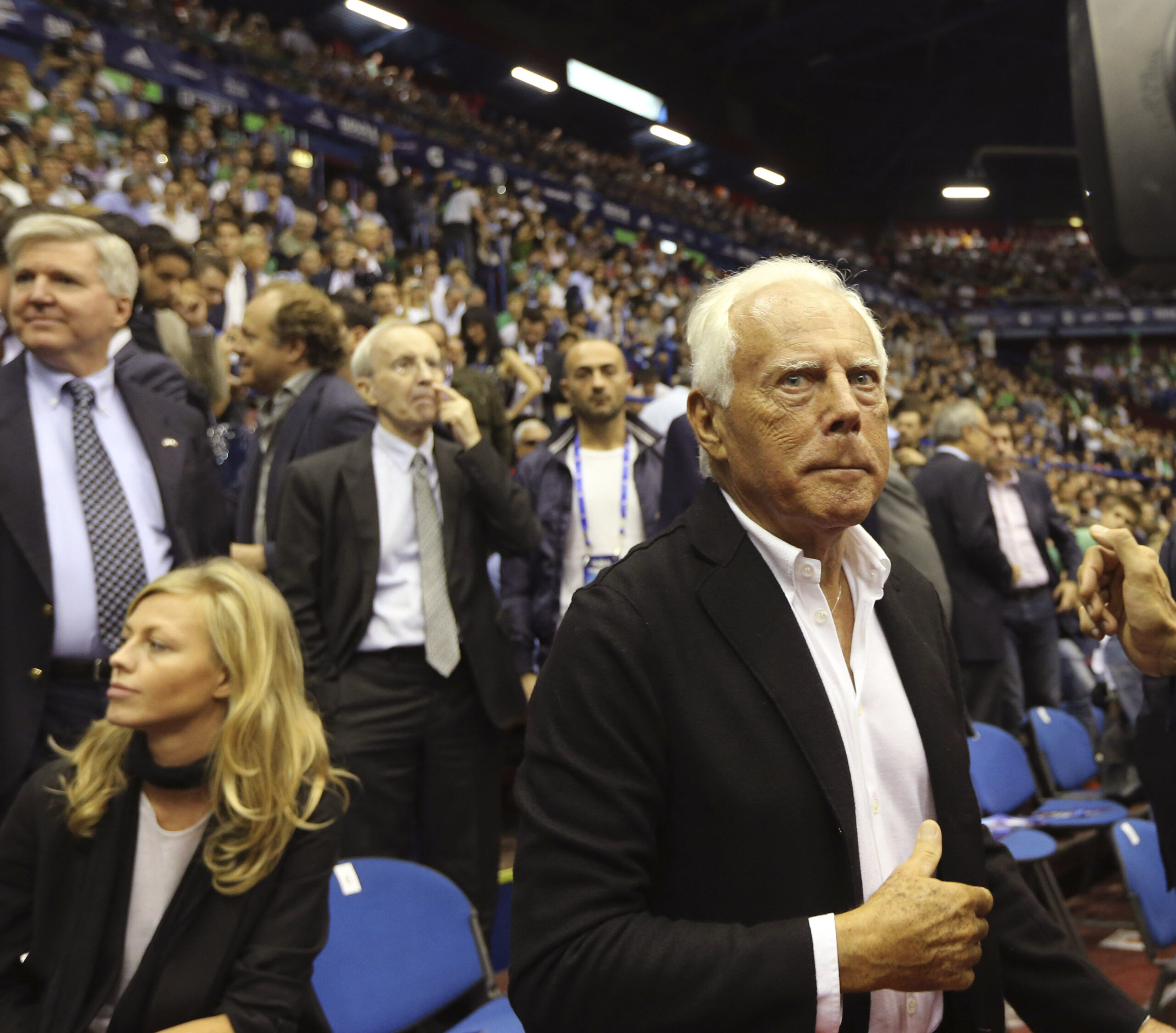 Italian fashion designer Giorgio Armani arrives for the Boston Celtics' against EA7 Emporio Armani exhibition basketball game in Milan, Italy, Sunday, Oct. 7, 2012. (AP Photo