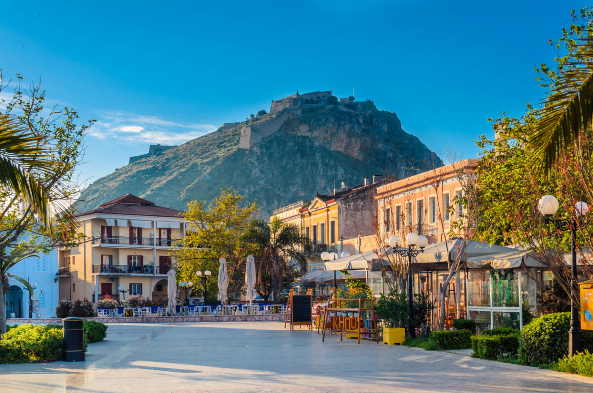 Nafplio-Greece April 12 2017 Philellinon square-The historic square of the city located in the old town.The castle of Palamidi in the background.