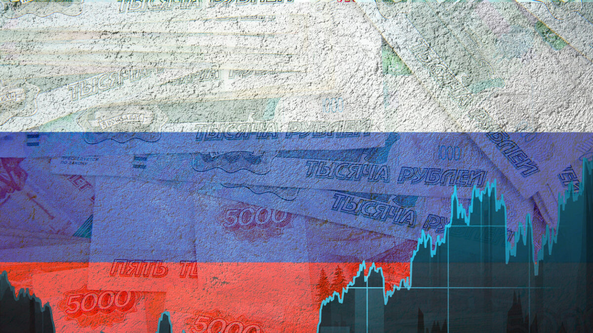 Graph of the ruble exchange rate against the background of the Russian flag and paper banknotes. Political and economic component of the country.