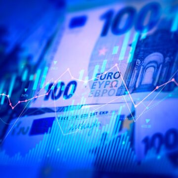 Euro banknotes with stock market chart graph for currency exchange and global trade forex concept
