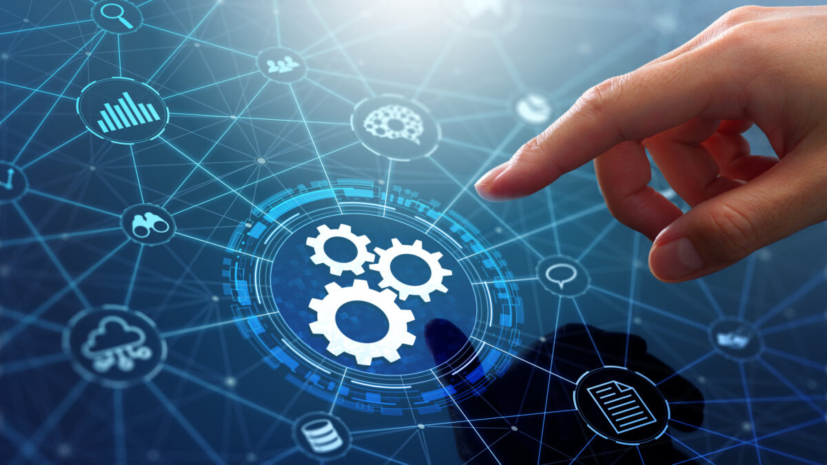 Businessman touching gears icon on network connection.