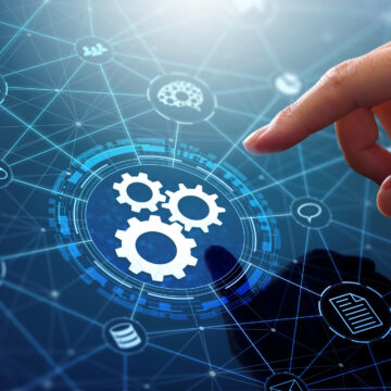 Businessman touching gears icon on network connection.