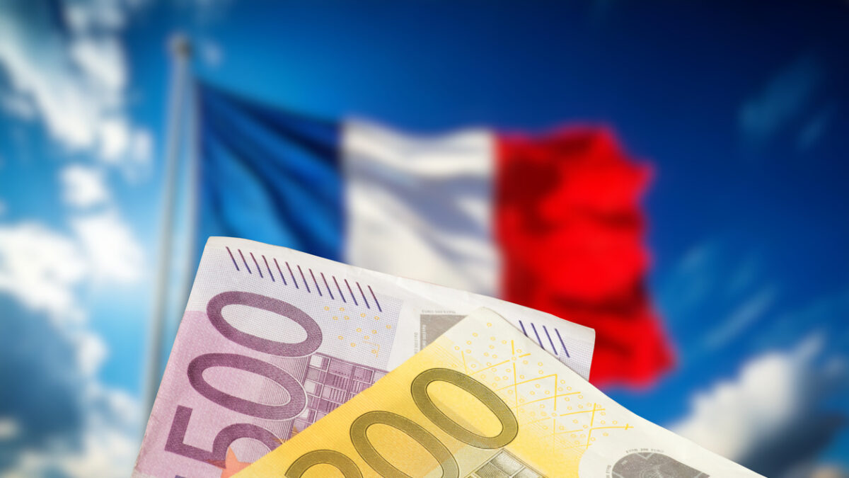 Flags of France and money Euro banknotes
