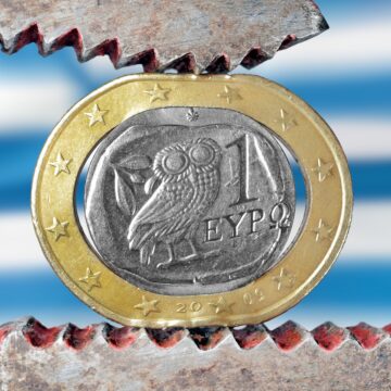 Greek euro stressed with a plier symbolizing the financial problems of the country