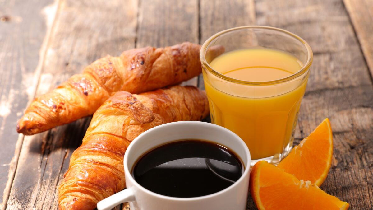 coffee cup with croissant and orange juice