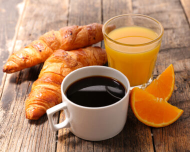 coffee cup with croissant and orange juice