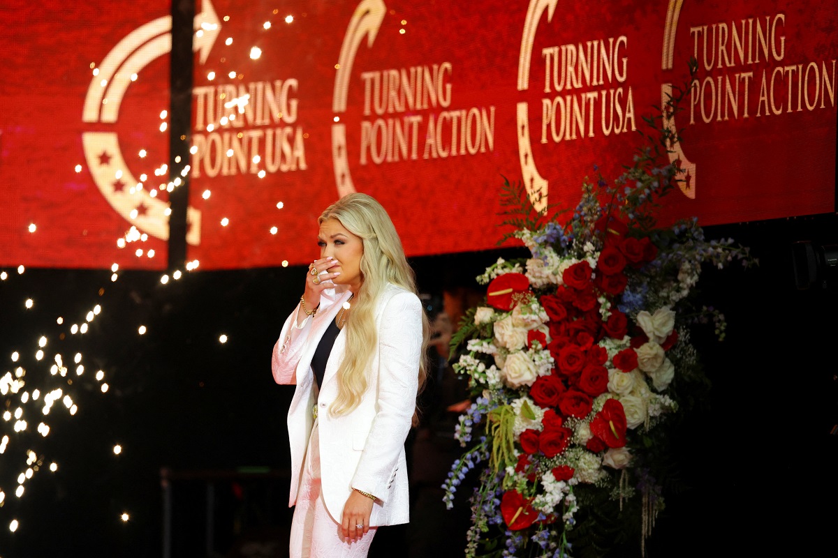 Erika Kirk gestures before speaking during a memorial service for her husband, slain conservative commentator Charlie Kirk, at State Farm Stadium in Arizona, U.S., September 21, 2025. REUTERS/Carlos Barria