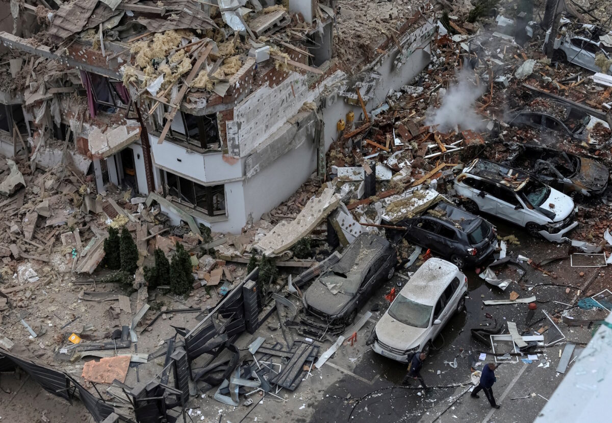 Damaged buildings and cars by Russian attacks