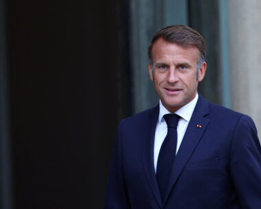 French President Emmanuel Macron welcomes a guest at the Elysee Palace in Paris, France, August 27, 2025. REUTERS