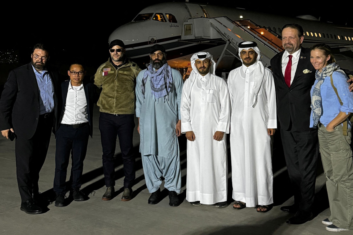 Amir Amir (third from left) with diplomats from US and Qatar after his release