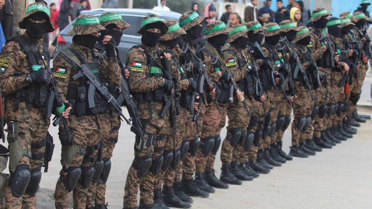 Palestinian Hamas militants stand guard before they release hostages held in Gaza since the deadly October 7, 2023 attack, as part of a ceasefire and a hostages-prisoners swap deal between Hamas and Israel, in Deir Al-Balah in the central Gaza Strip, February 8, 2025. REUTERS