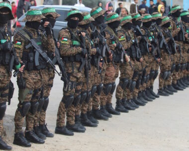 Palestinian Hamas militants stand guard before they release hostages held in Gaza since the deadly October 7, 2023 attack, as part of a ceasefire and a hostages-prisoners swap deal between Hamas and Israel, in Deir Al-Balah in the central Gaza Strip, February 8, 2025. REUTERS